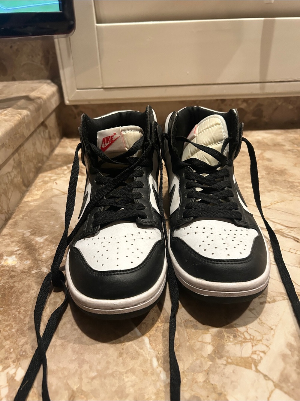 Nike Black and White Mid-Top Sneakers with Red Logo